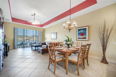 Tiled dining space with ceiling fan with notable c