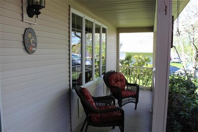 Covered Front Porch with new railing installed 200