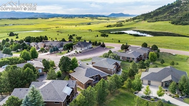 Aerial view of residential area featuring a water and mountain view
