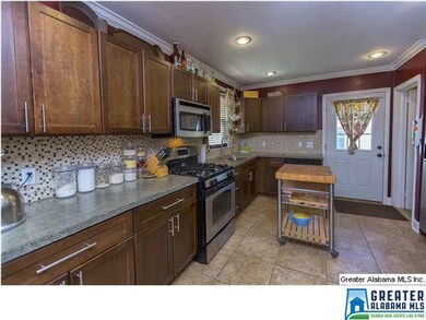 Cozy Kitchen with Mosaic Tile Backsplash, Tile Flo