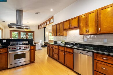 Chefs will enjoy the Wolf range, Subzero refrigerator and plentiful granite counters