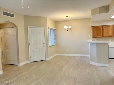 Kitchen with light countertops, visible vents, bro