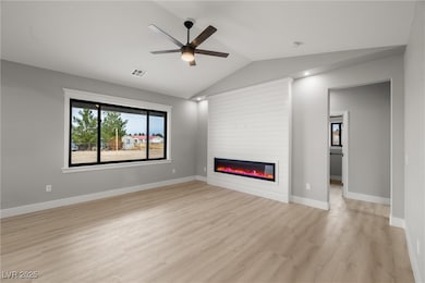 Living room, with a shiplap style electric firepla