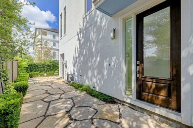 Gated entrance to front door with flagstone patio.