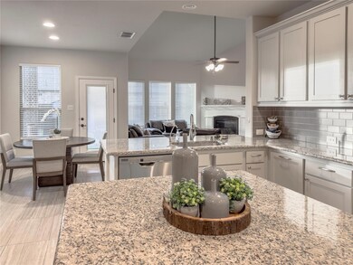 Modern kitchen with stainless steel appliances, li