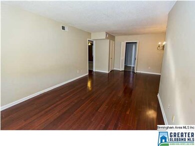 Nice, bright living/dining room with rich, hardwoo