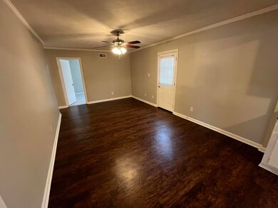 Unfurnished room featuring dark wood-type flooring