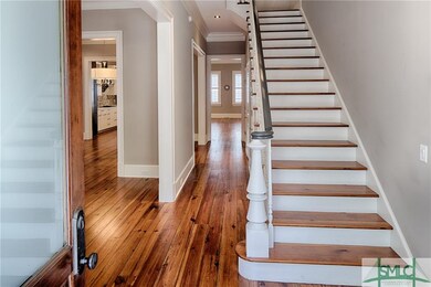 Double entry doors lead to the Foyer, and the open