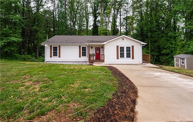 Single story home with a storage unit, an outdoor 