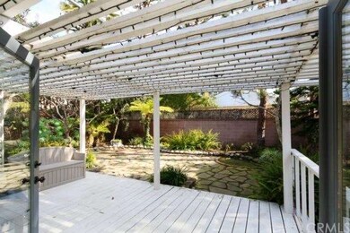 French doors lead to an open garden back yard