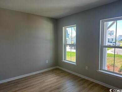Spare room featuring hardwood / wood-style floors