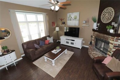 Great room with hardwood floors, vaulted ceilings,