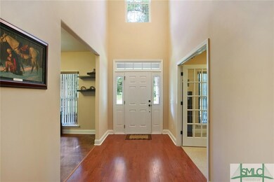 2 Story Foyer Entrance with Wood Flooring.  Study 