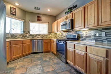 Kitchen with tile floors, decorative backsplash, C