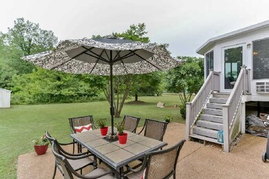Great back patio ready for entertaining and grilling out just off the sunroom. Perfect for summer fun!