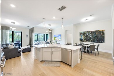 Kitchen with pendant lighting, an island with sink