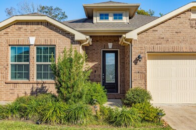 Home features a welcoming front door, modern design and easy maintenance landscaping.