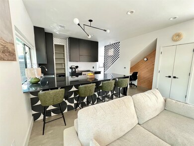 Living room featuring a chandelier, visible vents