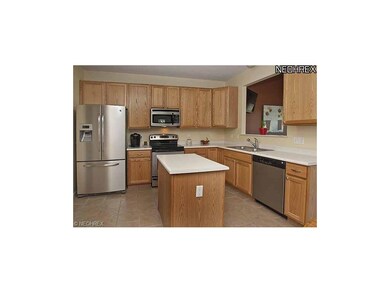 Kitchen has been updated with tile flooring and ti