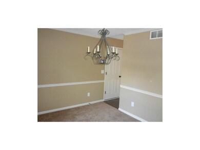 Formal Dining room w/ chair rail, neutral color pa