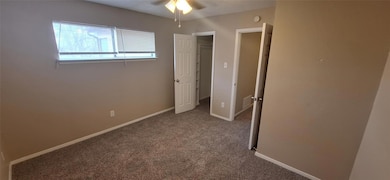 Unfurnished bedroom with visible vents, a ceiling 