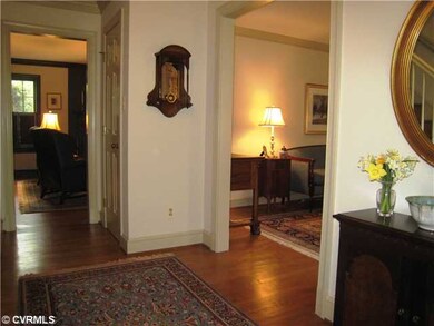 Foyer - Spacious foyer with crown moulding, brass 