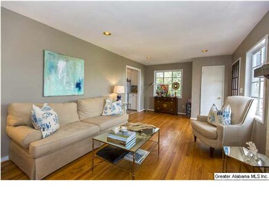 Large living room with hardwood floors & fireplace