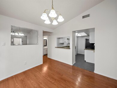 Unfurnished living room with a sink, lofted ceilin