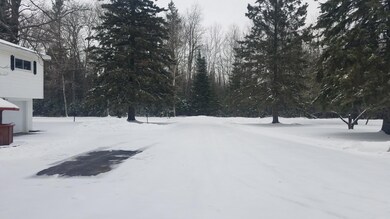 Paved Drive into Side yard