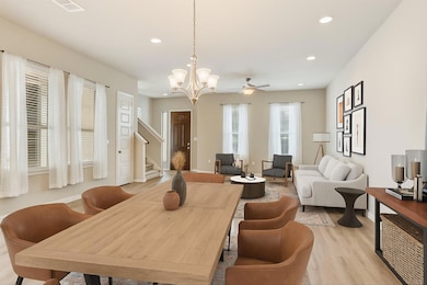 Dining room with recessed lighting, stairway, lig