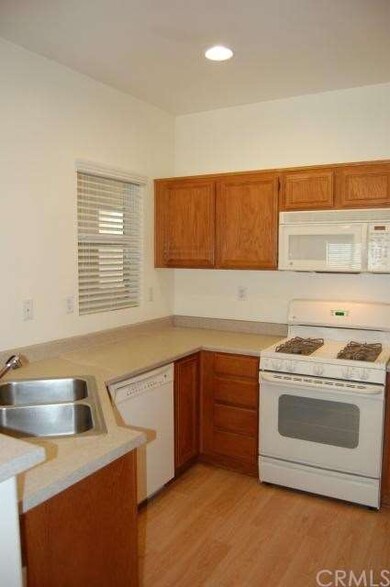 Kitchen Has Stainless Steel Sink With Pullout Faucet.  Built-in Dishwasher.  Gas Range With Over The Counter Microwave.  Laminate Flooring.  New 2 Inch Blinds.