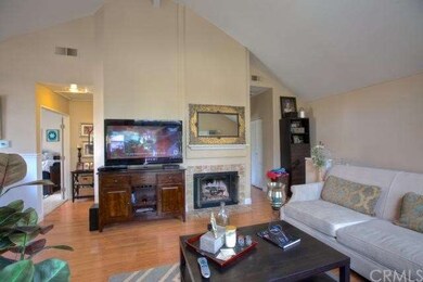 Family Room with fireplace, laminate wood flooring