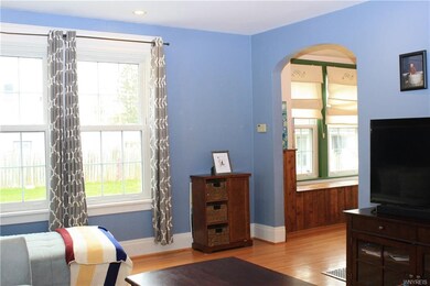 Living room with dining entrance.