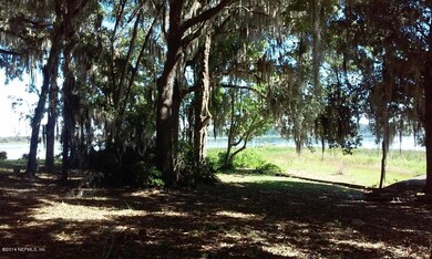 Beautiful view of lake thru trees