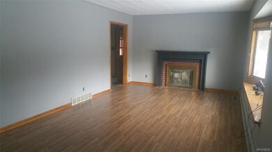 Freshly painted living room. New flooring. Bay win