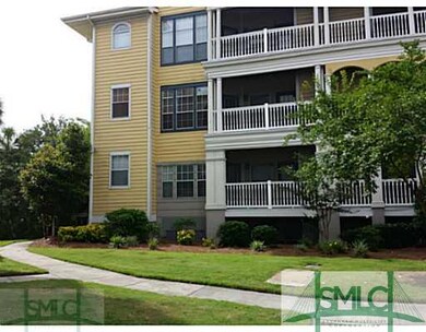 Exterior Front. End unit, building backs up to mar