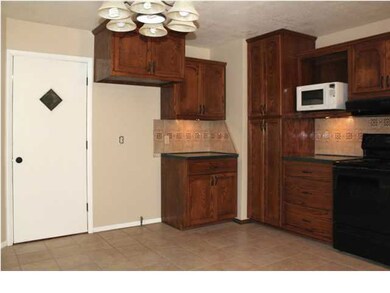STEP INTO KITCHEN FROM GARAGE & APPRECIATE THE CER
