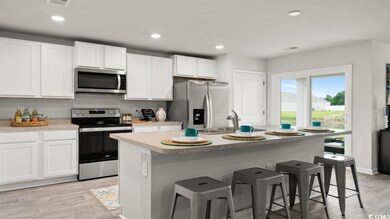 Kitchen with appliances with stainless steel finis