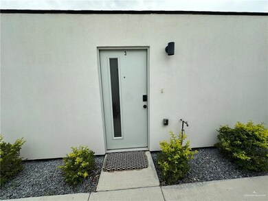 Doorway to property featuring stucco siding