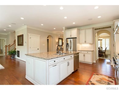 Open kitchen with KitchenAid stainless appliances,