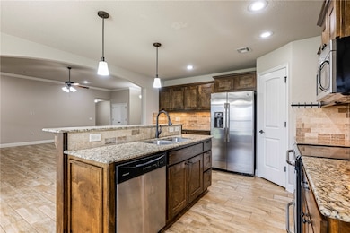 Open concept kitchen, granite countertops, fridge conveys!