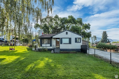 Bungalow featuring a chimney