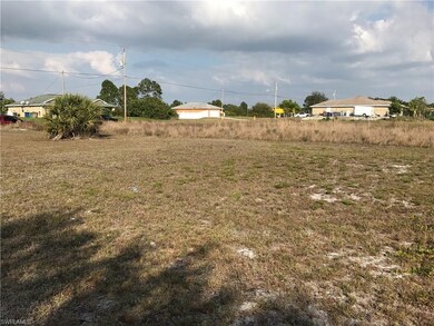 Standing on the West side of the lot looking to th