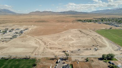 Aerial overview of property's location featuring rural landscape and a desert landscape