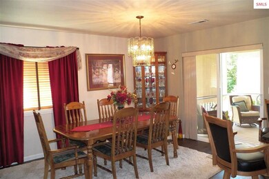 With Sliding glass doors out to the covered deck.