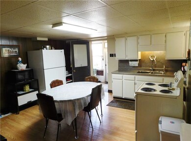 Spacious kitchen includes electric stove, microwav