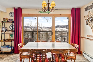 Dining area featuring a mountain view, a chandelie