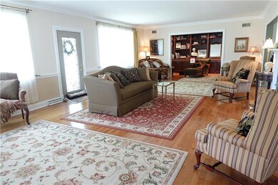 Spacious Formal Living Room with hardwood flooring