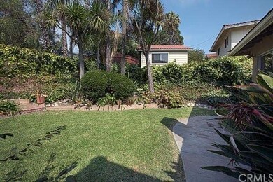 Rear flat grassy yard with upslope for landscaping