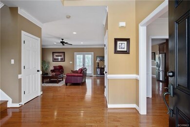 Gorgeous two story foyer with wood floors.